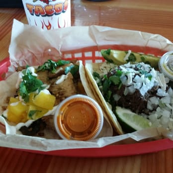 Torchy's Tacos - The Bushfire and Democrat. Jamaican style jerk chicken on the left, shredded barbacoa on the right... both were fantastic! - Tex-Mex Near Me - Round Rock, Texas Torchy's Tacos - The Bushfire and Democrat. Jamaican style jerk chicken on the left, shredded barbacoa on the right... both were fantastic! - Tex-Mex Near Me - Round Rock, Texas