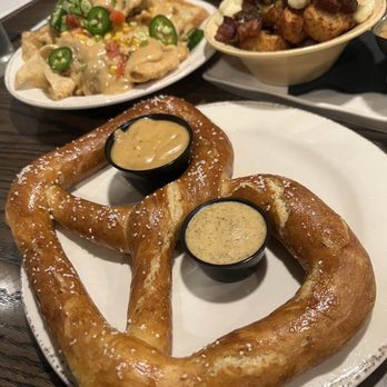 Cobblestone On Main - Large pretzel, nachos and Poutots!!! - New American Near Me - Webster, New York
