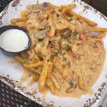 Mambo’s - Poutine with craw fish tails - Cajun/Creole Near Me - New Orleans, Louisiana Mambo’s - Poutine with craw fish tails - Cajun/Creole Near Me - New Orleans, Louisiana