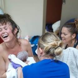 Coastal Maternity Care - Sharon and Kara support an ecstatic mother moments after birth