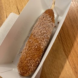 a doughnut in a paper container