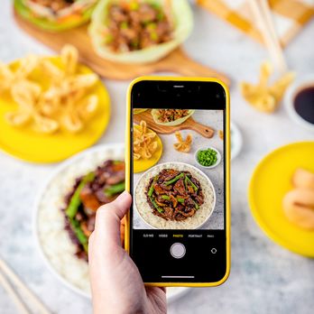 Pick Up Stix Fresh Asian Flavors - a person taking a picture - Chinese Near Me - Downey, California Pick Up Stix Fresh Asian Flavors - a person taking a picture - Chinese Near Me - Downey, California