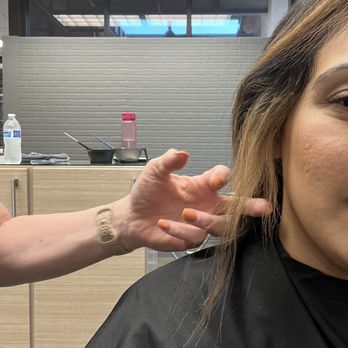 Love Salon - When I went to Bliss Salon in Turlock. The hairdresser showing me the damage Andrea caused. - Hair Salons Near Me - Turlock, California