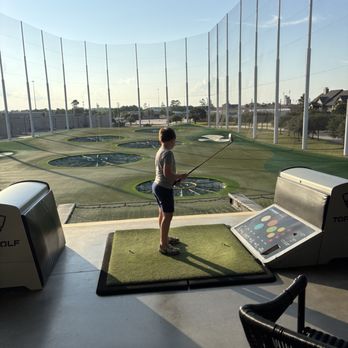Topgolf - Kid golfing - Sports Bars Near Me - Spring, Texas