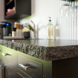 Signature Countertops - Black Pearl Leathered granite with a 6cm (stacked) hand-chiseled edge.