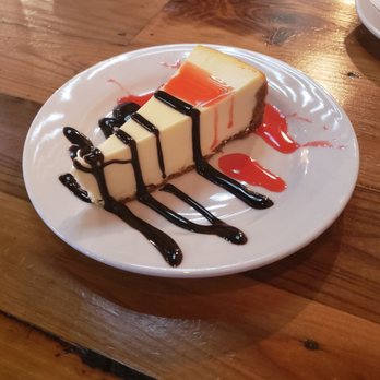 Orchard Bar & Grill - Cheesecake with chocolate and strawberry sauce - Bars Near Me - Chowchilla, California