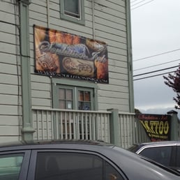 Outside of the shop, the stairs to the door face the main road Outside of the shop, the stairs to the door face the main road