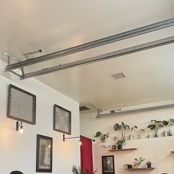 Fressen Artisan Bakery - Was that a garage door track? I like those plants rooting in water, as decorative. - Bakeries Near Me - Portland, Oregon Fressen Artisan Bakery - Was that a garage door track? I like those plants rooting in water, as decorative. - Bakeries Near Me - Portland, Oregon