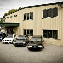 Import Specialty Service - A view of our car repair shop with European cars parked in front.
