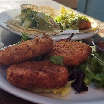 Zelda's - Baja fish tacos in the background and crab cakes. - Bars Near Me - Capitola, California Zelda's - Baja fish tacos in the background and crab cakes. - Bars Near Me - Capitola, California