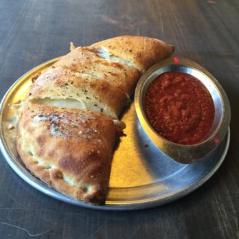 Satchel's Pizza - The lots of meat calzone - Pizza Near Me - Gainesville, Florida Satchel's Pizza - The lots of meat calzone - Pizza Near Me - Gainesville, Florida