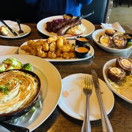 Shepard's pie, Scottish eggs, cheese curds, and bratwurst. Delicious, comforting food. Shepard's pie, Scottish eggs, cheese curds, and bratwurst. Delicious, comforting food.