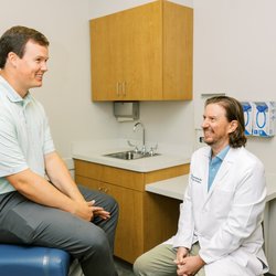 West Georgia Dermatology - Paul Haun MD - board-certified dermatologist and dermatopathologist - with a patient.