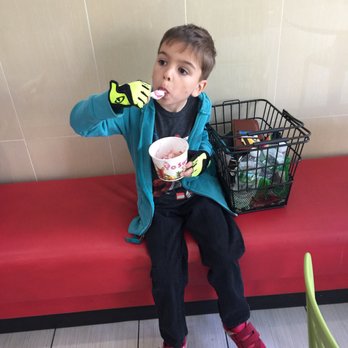 YoSweets - a young boy sitting on a bench with a cup of coffee - Desserts Near Me - New York, New York YoSweets - a young boy sitting on a bench with a cup of coffee - Desserts Near Me - New York, New York