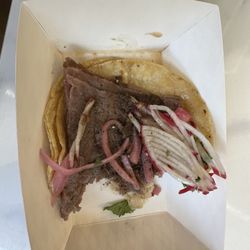 Half eaten steak taco