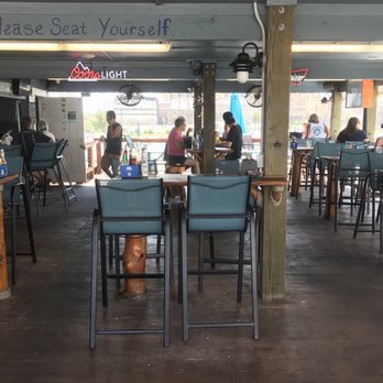 Marina Bar & Grill - Covered seating on the deck - American Near Me - Galveston, Texas