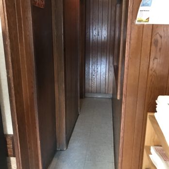 Sawmill - a narrow hallway with wood paneled walls - Diners Near Me - Clarion, Pennsylvania