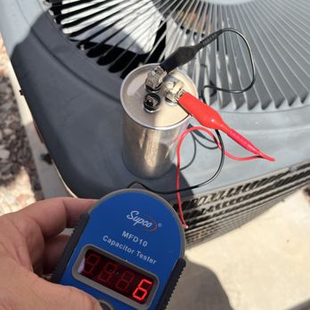 Genius Home - Replacing damaged capacitors on AC condensing unit - Electricians Near Me