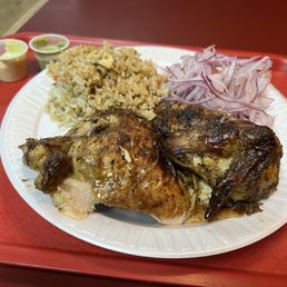 Half chicken with red onion, salad, and fried rice Half chicken with red onion, salad, and fried rice