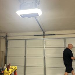 James and the newly installed garage motor. James and the newly installed garage motor.