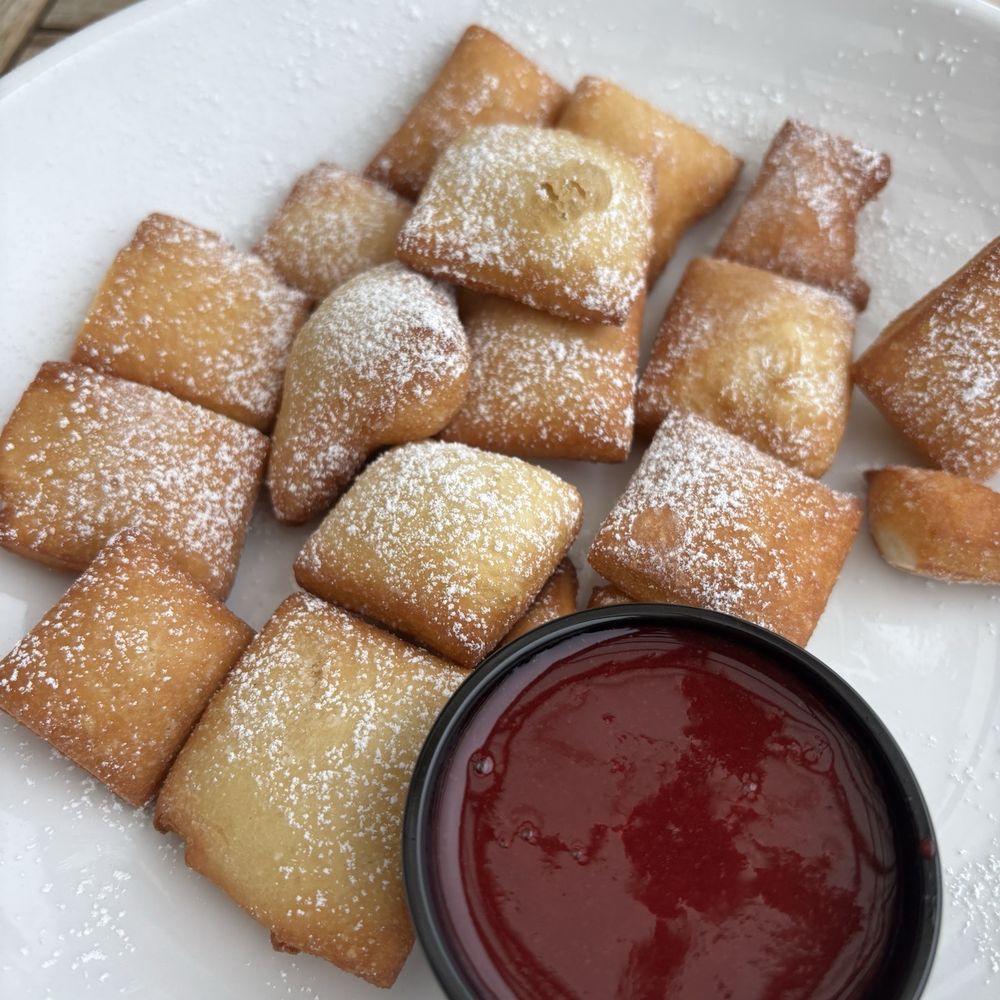 Waterside Social - Beignets with mixed berry sauce. - Wine Bars Near Me - Lake Orion, Michigan Waterside Social - Beignets with mixed berry sauce. - Wine Bars Near Me - Lake Orion, Michigan