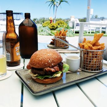 Quarterdeck Kitchen & Bar - Wagyu Beef burger on a brioche bun. - Seafood Near Me - Coomera, QLD Quarterdeck Kitchen & Bar - Wagyu Beef burger on a brioche bun. - Seafood Near Me - Coomera, QLD