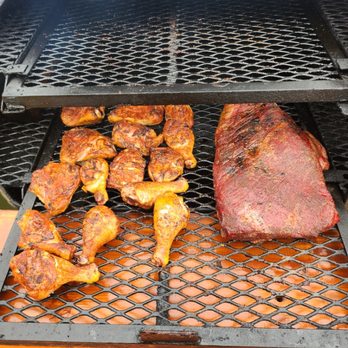 Good Boyz BBQ - the meat being cooked on the grill - Food Trucks Near Me