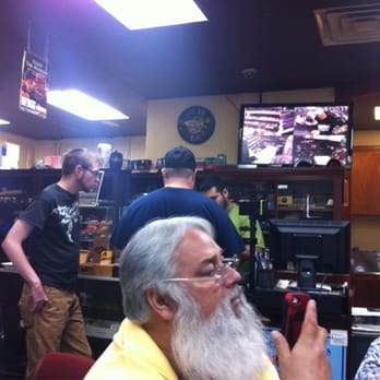 Lake Worth Cigars - a man smoking a cigarette - Tobacco Shops Near Me - Fort Worth, Texas