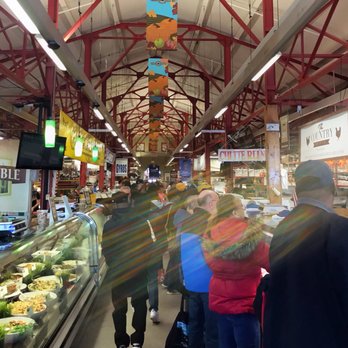 Findlay Market - Crowded Saturday headed down the main aisle of meat and food vendors - Farmers Market Near Me - Cincinnati, Ohio