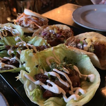 Little Bad Wolf - Steak lettuce wrap tacos in front, pork tacos and pork bao in the back - American Near Me - Chicago, Illinois Little Bad Wolf - Steak lettuce wrap tacos in front, pork tacos and pork bao in the back - American Near Me - Chicago, Illinois