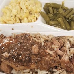 Smothered pork chop, green beans, and mac & cheese