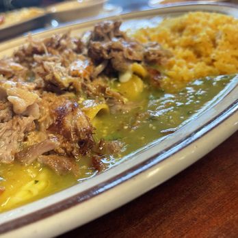 La poblanita - Enchiladas Suizas (cheese enchiladas topped with Carnitas pork and verde sauce), served with rice and beans - Mexican Near Me - Newton, Illinois La poblanita - Enchiladas Suizas (cheese enchiladas topped with Carnitas pork and verde sauce), served with rice and beans - Mexican Near Me - Newton, Illinois