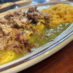 La poblanita - Enchiladas Suizas (cheese enchiladas topped with Carnitas pork and verde sauce), served with rice and beans