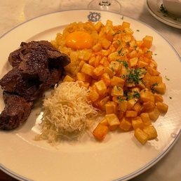 BIFF RYDBERG Pan fried diced tenderloin, diced potatoes, fried onions and egg yolk