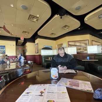 Mellow Mushroom Wilder - My hubby sitting at our table. - Pizza Near Me - Wilder, Kentucky Mellow Mushroom Wilder - My hubby sitting at our table. - Pizza Near Me - Wilder, Kentucky