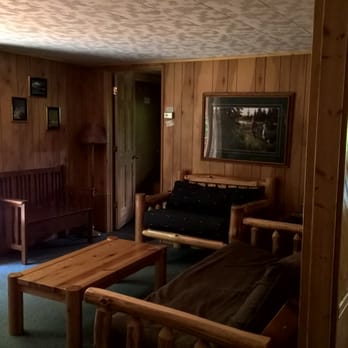 Timber Trail Lodge & Outfitters - Blue Spruce - LR bench, futon love seat - door to bedroom 4 - Resorts Near Me - Ely, Minnesota