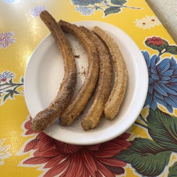 Cocoa Cinnamon - 4 churros (left 3 cinnamon sugar and last right orange sugar) - Coffee & Tea Near Me - Durham, North Carolina Cocoa Cinnamon - 4 churros (left 3 cinnamon sugar and last right orange sugar) - Coffee & Tea Near Me - Durham, North Carolina