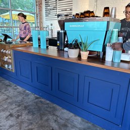 a man and a woman behind the counter