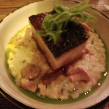Harbinger - Pork belly entree sitting on sweet corn Congee with mushrooms and chive oil - New American Near Me - Des Moines, Iowa