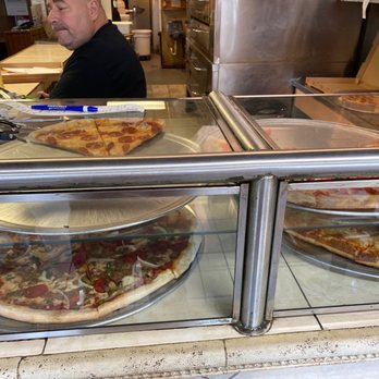 Pizza Suprema - Their Display. - Pizza Near Me - Lutz, Florida Pizza Suprema - Their Display. - Pizza Near Me - Lutz, Florida
