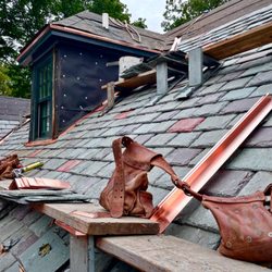 Jack's Roofing Company - Photos of Jack's Roofing's craftsmen installing a new mixed Vermont slate roof in Washington, DC.