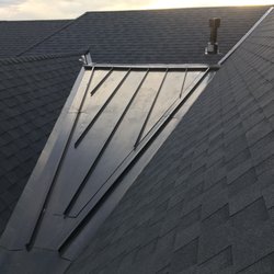 Encore Roofs - Metal standing seam roofing installed to remedy snow and ice build up.