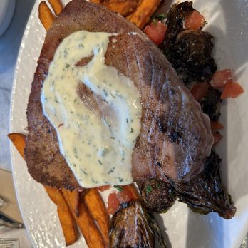 California Fish Grill - Ahi tuna seared rare with garlic butter sauce, Brussels sprouts, and sweet potato fries. - Seafood Near Me - Las Vegas, Nevada