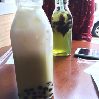 Plentea - Matcha green tea with honey boba in the foreground and honeydew fruit tea with grass jelly in the background - Tea Rooms Near Me - San Francisco, California Plentea - Matcha green tea with honey boba in the foreground and honeydew fruit tea with grass jelly in the background - Tea Rooms Near Me - San Francisco, California