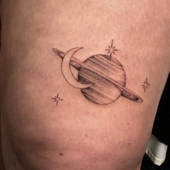 Eden Tattoo Gallery - Crescent moon closely orbiting Saturn with stars tattoo above left knee. - Tattoo Near Me - San Diego, California Eden Tattoo Gallery - Crescent moon closely orbiting Saturn with stars tattoo above left knee. - Tattoo Near Me - San Diego, California