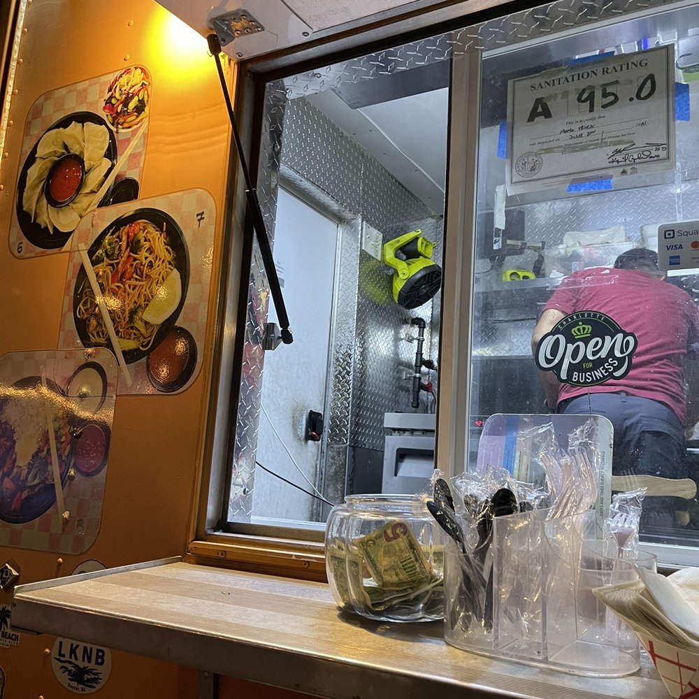 Momo Truck - a woman preparing food in a kitchen - Food Trucks Near Me - Charlotte, North Carolina Momo Truck - a woman preparing food in a kitchen - Food Trucks Near Me - Charlotte, North Carolina