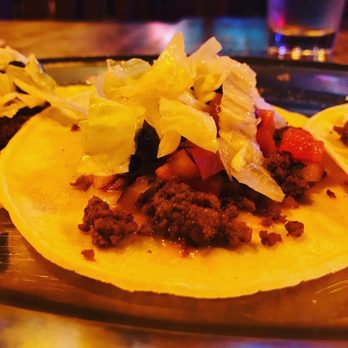 Elwoods - two tacos on a plate on a table - Pubs Near Me - Vancouver, British Columbia Elwoods - two tacos on a plate on a table - Pubs Near Me - Vancouver, British Columbia