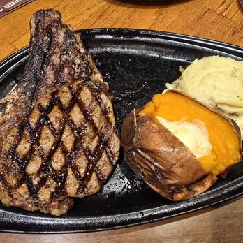 Outback Steakhouse - Bone-in ribeye with sweet potato & homestyle mashed potatoes - Steakhouses Near Me - Westbury, New York