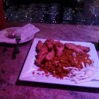 Castaway Restaurant and Bar - Chicken wings and fried rice. Hot sauce is perfect. Its very hot so be careful. - Caribbean Near Me - Orange, New Jersey Castaway Restaurant and Bar - Chicken wings and fried rice. Hot sauce is perfect. Its very hot so be careful. - Caribbean Near Me - Orange, New Jersey