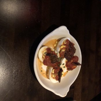 Yard House - Deviled Eggs with Tomato and Candied Bacon Topping - New American Near Me - Irving, Texas Yard House - Deviled Eggs with Tomato and Candied Bacon Topping - New American Near Me - Irving, Texas